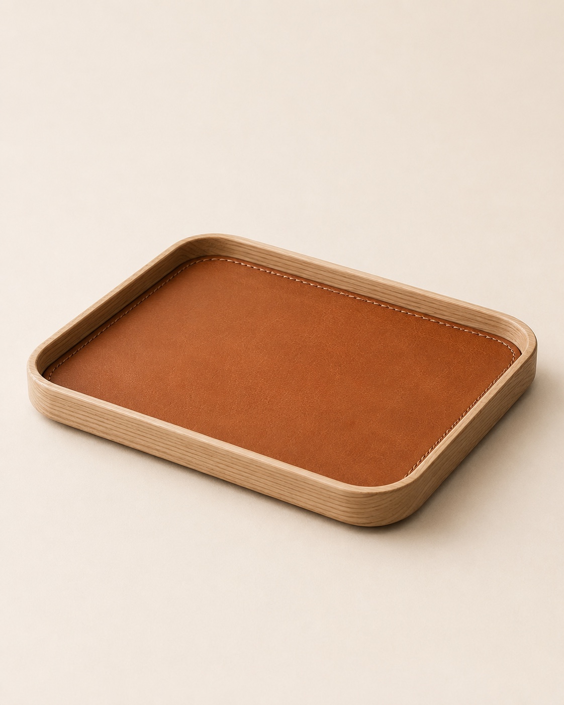 Folio Desk Tray with a light wood frame and stitched saddle-coloured leather surface
